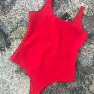 Red form fitting bodysuit